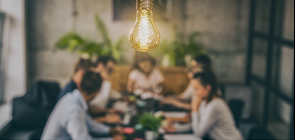 people at table discussing ideas